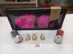 A pair of Chinese pottery chopstick rests and 3 small signed resin figures and a pair of boxed