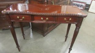 A three drawer mahogany side table. COLLECT ONLY.