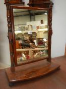 An early 20th century mahogany toilet mirror. COLLECT ONLY.