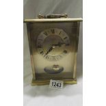 A Smith's brass quartz clock, in working order.