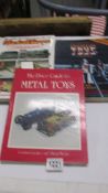 Three rare books on metal toys including tinplate, diecast price guides.