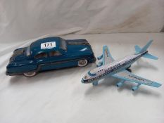 A Japanese tinplate and plastic aeroplane and a large tin plate car