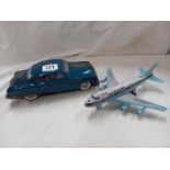 A Japanese tinplate and plastic aeroplane and a large tin plate car