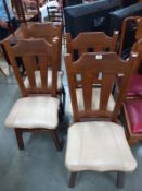 A set of 4 leather seat dining chairs