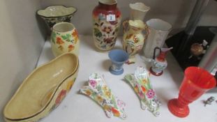10 assorted vases and a pair of wall pockets.