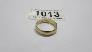 A 9ct gold wedding ring, size N. 2.3 grams.