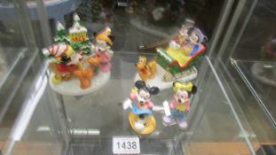 Two 'The Walt Disney Company' Christmas figures by Schmid and two tree hangings.