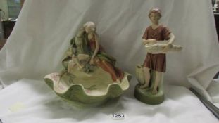 Two Royal Dux figures - lady on bowl (a/f, crack to base and bird wing chipped) and a boy (a/f)