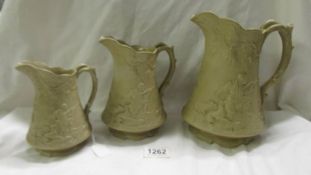 A set of three Victorian graduated hunting scene jugs by Edward Whalley, Cobridge, Staffordshire,