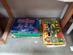 A selection of vintage Aussie Rules board games including Monopoly, all unchecked.