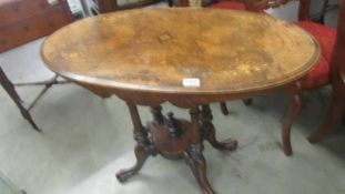 An oval mahogany inlaid table. COLLECT ONLY.