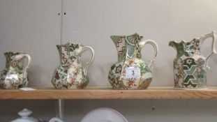 A set of 3 Mason's applique' pattern jugs and one other.