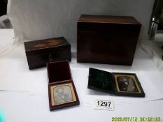 A mahogany tea caddy, a mahogany card box and two travelling photo frames.