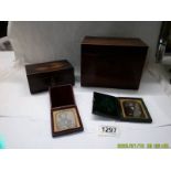 A mahogany tea caddy, a mahogany card box and two travelling photo frames.