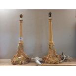 A pair of heavy ornate classical designed table lamps