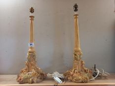 A pair of heavy ornate classical designed table lamps