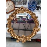 A gilt framed mirror. Collect only