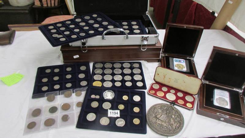 A mixed collection of coins including 2 boxed restrikes - Cromwell Crown and George IV 1826 £5,