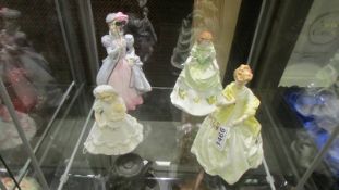 Four Royal Worcester figurines.