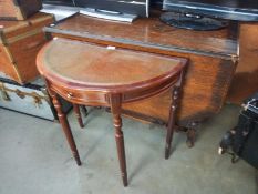 An oak drop leaf, barley twist dining table & a leather top D table