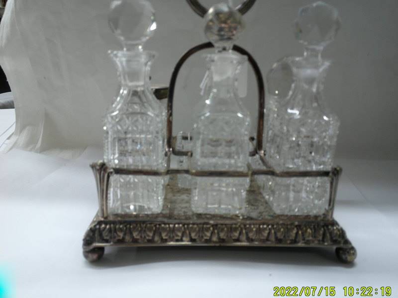 A six bottle condiment set on silver plate stand. - Image 3 of 3