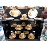 3 shelves of Alfred Meakin farming scene tableware, mainly cup and saucer trios