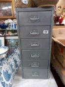 A grey metal 6 drawer filing cabinet. 66cm x 28cm x 41cm