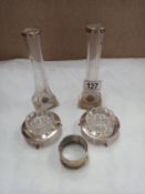 A pair of silver topped spill vases, silver plated napkin rings etc