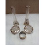 A pair of silver topped spill vases, silver plated napkin rings etc