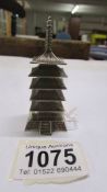 A silver pepperette in the shape of a pagoda. 35 grams.