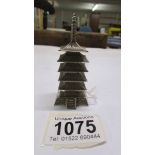 A silver pepperette in the shape of a pagoda. 35 grams.