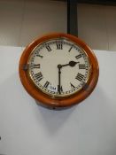 A chain driven circular wall clock. complete and working. COLLECT ONLY.