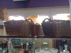 2 large wicker baskets with grab handles & a small suitcase