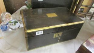 An ebonised writing box.