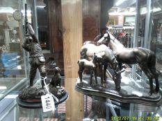 A horse figure group and a hunter figure with dog.