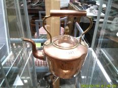 A Victorian copper kettle.