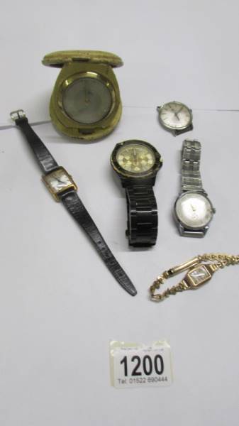 A vintage travel clock, a rolled gold ladies wristwatch and other watches.
