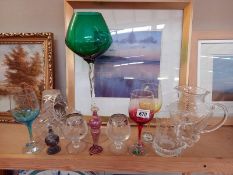 A good selection of cut glass including coloured glass