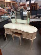 A mid 20th century 3 mirror serpentine dressing table & stool