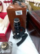 An old microscope in mahogany box