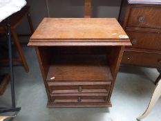 A small oak 2 drawer cabinet