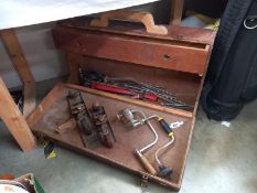 An early 20th century wooden tool box with tools