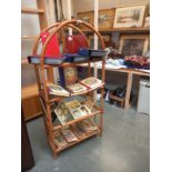 A bamboo domed top bookcase