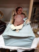 An old mid 20th century Doll A/F with old carry cot