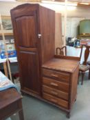 A combination single cupboard with 5 drawer chest