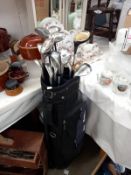 A selection of Ping & other golf clubs in bag