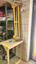 A JCB 4 legged roller bench and a router with bench