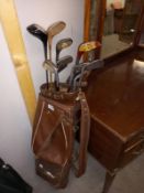 A quantity of vintage golf clubs with bag. COLLECT ONLY.