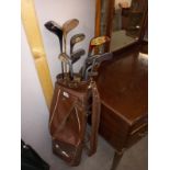 A quantity of vintage golf clubs with bag. COLLECT ONLY.