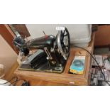 A vintage boxed Harris CB sewing machine